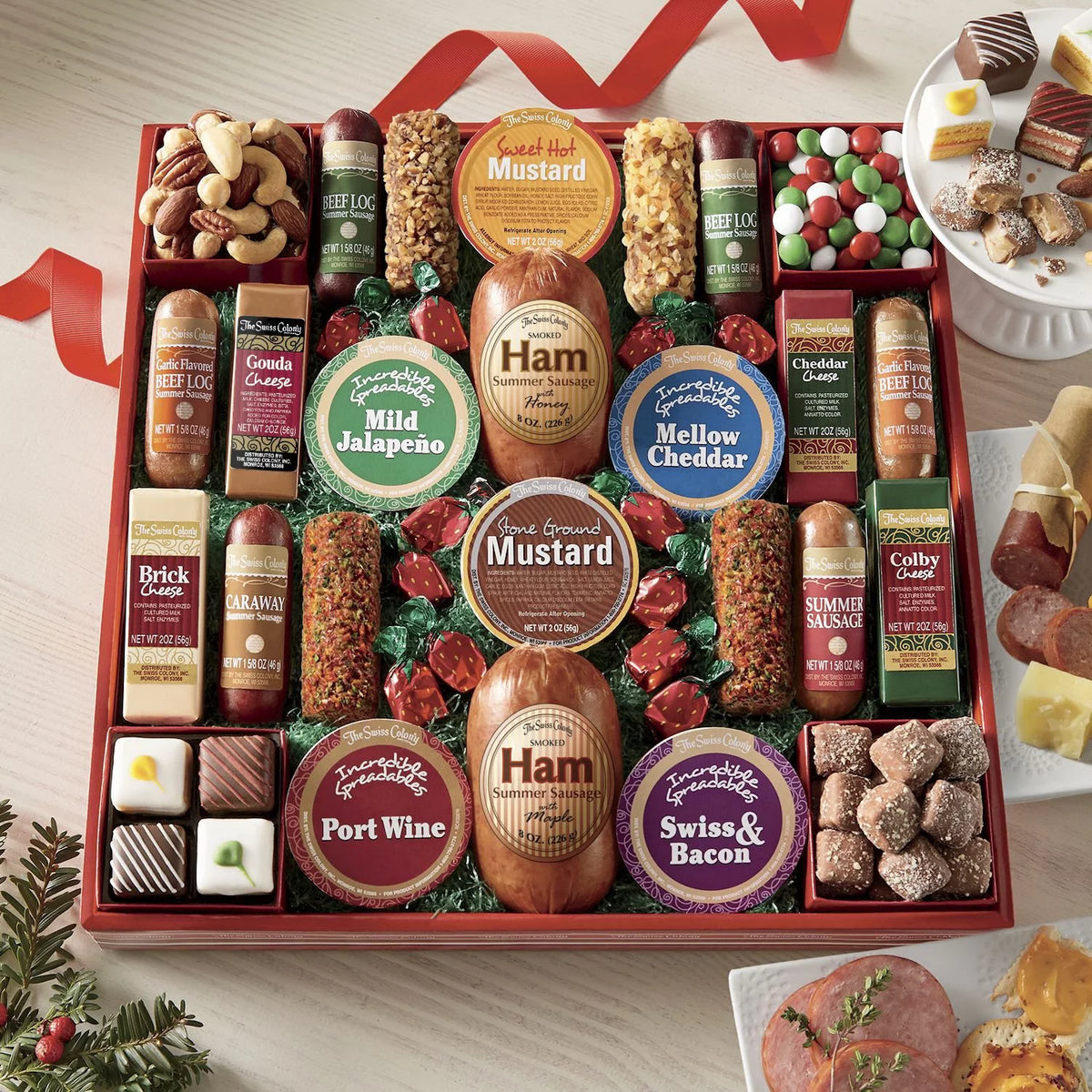 Assorted Holiday Treats with Ham Summer Sausages, Chocolates, Cheese Bars and Logs, and Candy A1755